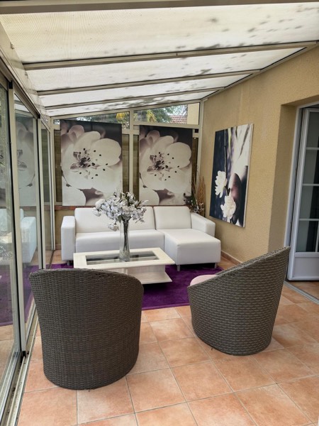 Espace détente de la véranda du Petit Domaine de la Belvaudière